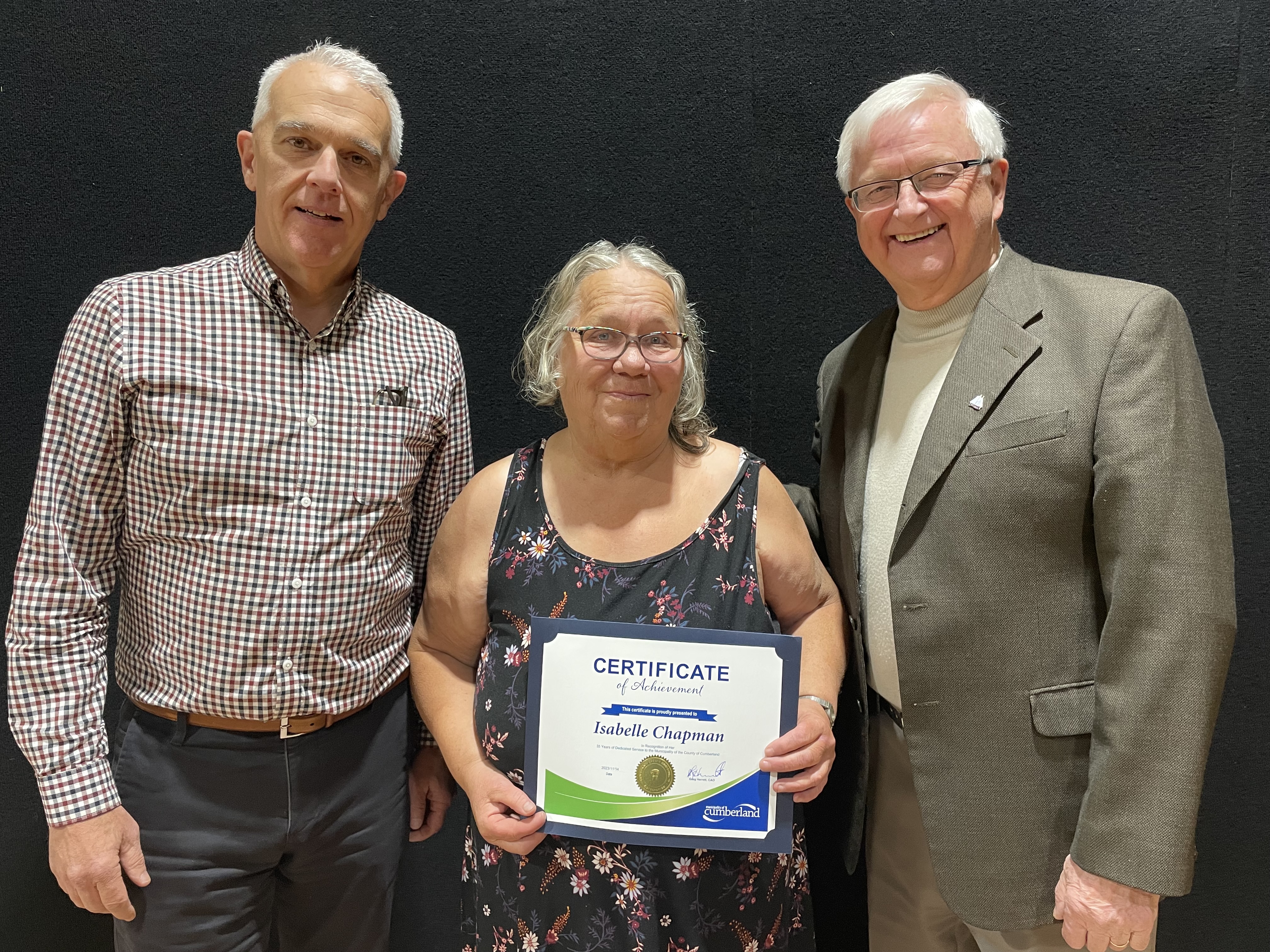 Isabel Chapman accepts her 35-year certificate from Municipality of Cumberland CAO Greg Herrett (left) and Mayor Murray Scott. Darrell Cole - Municipality of Cumberland photo