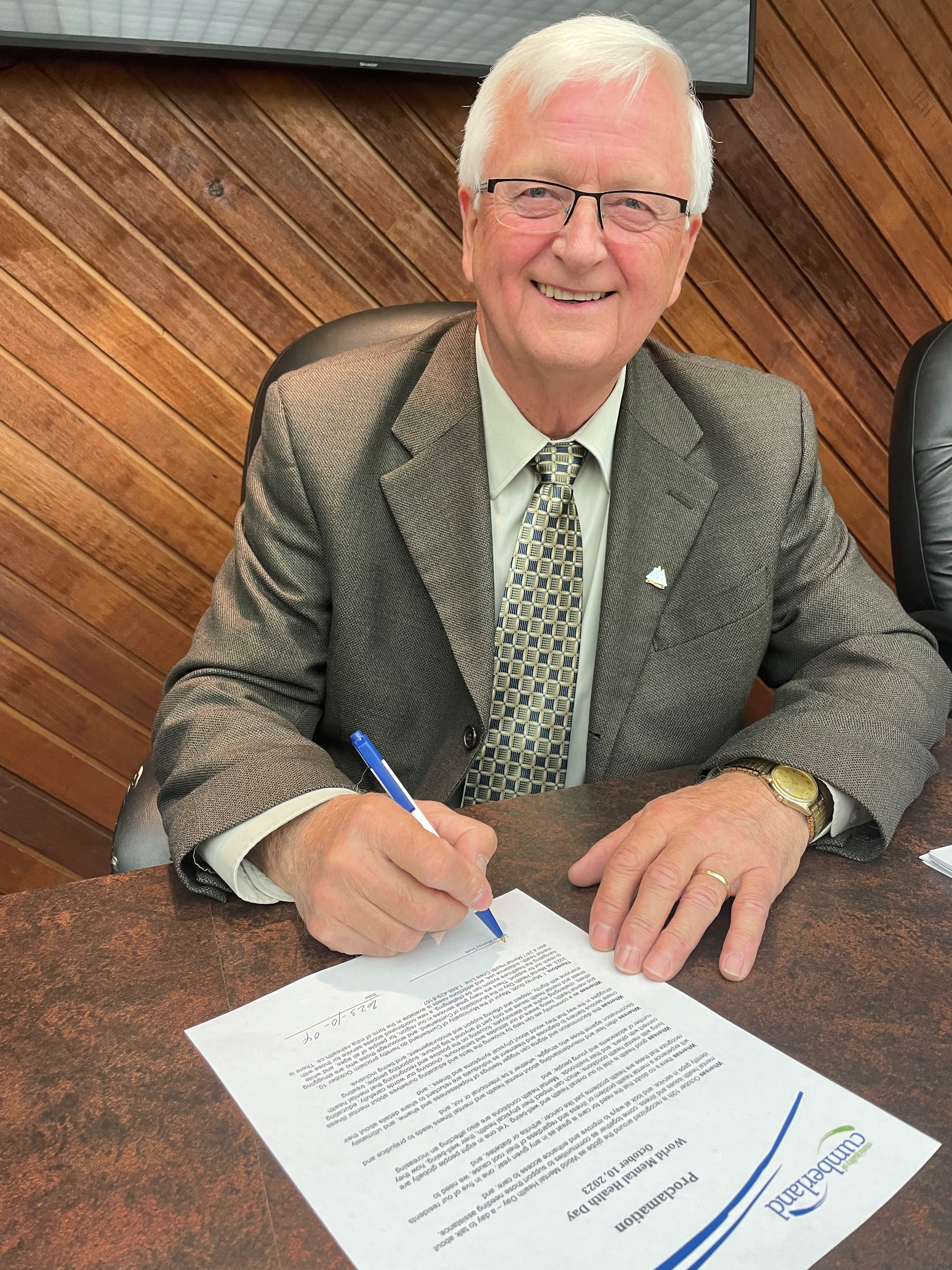 Municipality of Cumberland Mayor Murray Scott signs a proclamation declaring Oct. 10 as World Mental Health Day in Cumberland County.