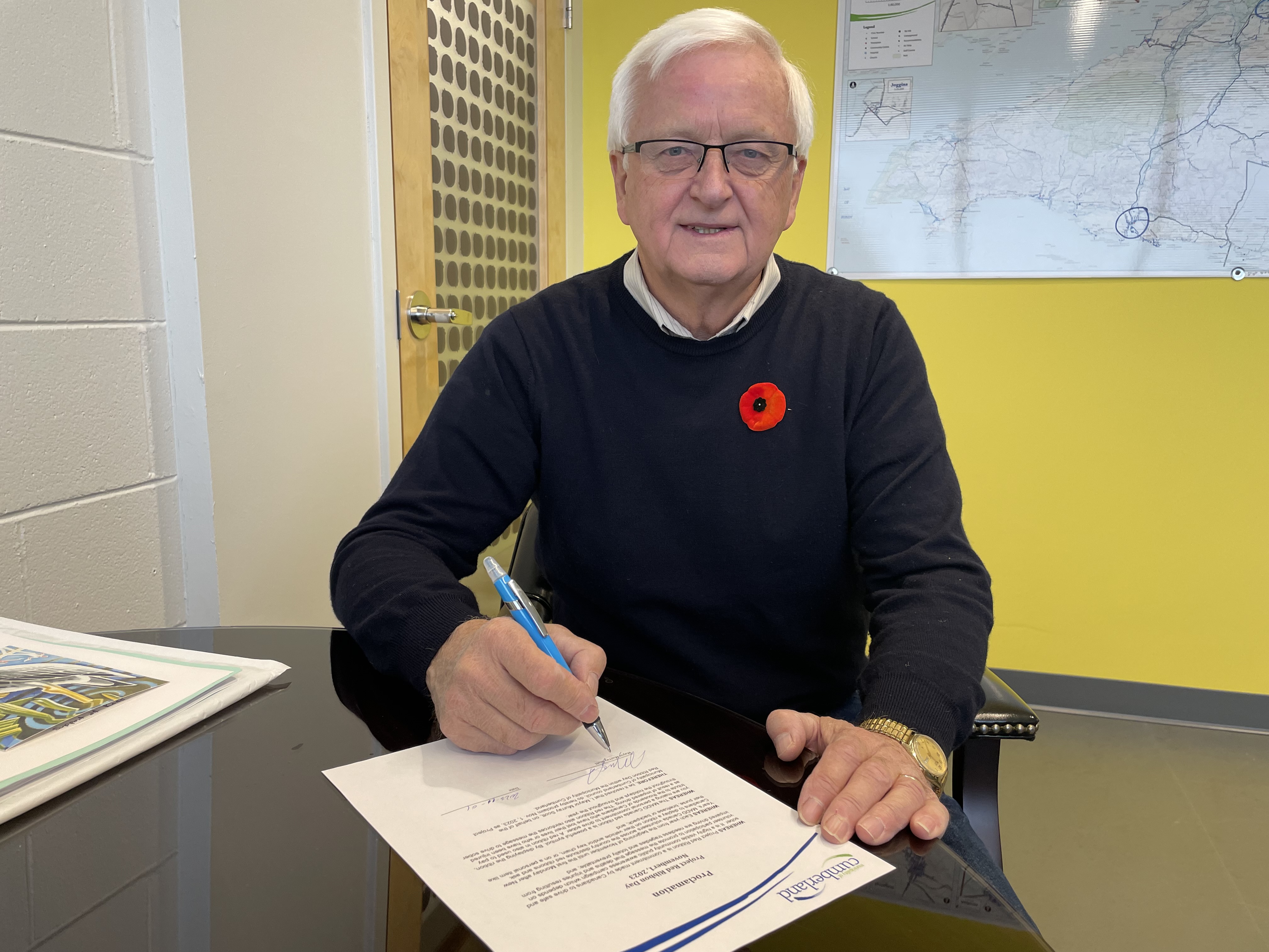 Municipality of Cumberland Mayor Murray Scott signs a proclamation declaring Nov. 1, 2023, as Project Red Ribbon Day within the municipality. Project Red Ribbon aims to raise awareness about the dangers of driving under the influence of alcohol, cannabis and/or other drugs. 