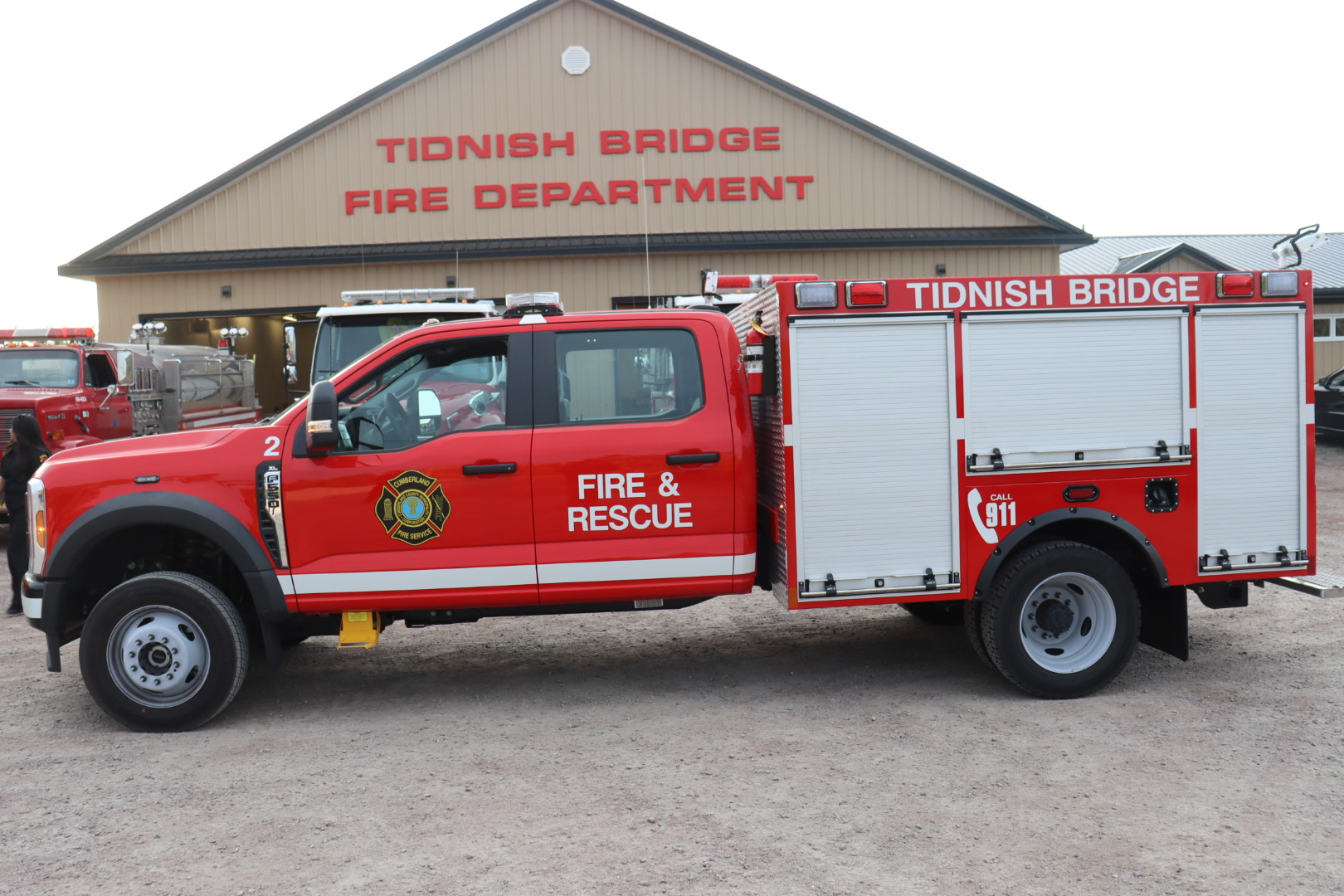 A red rescue vehicle sits in front of the Tidnish Bridge Fire Department building.